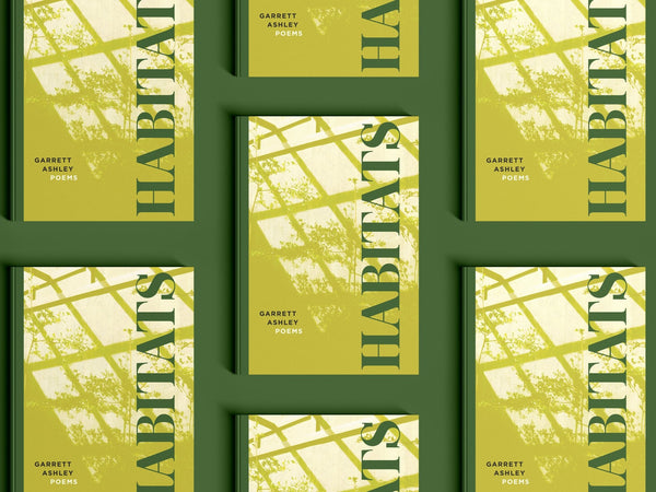 Open book titled "Habitats" by Loblolly Press, featuring illustrations and text about different natural environments.