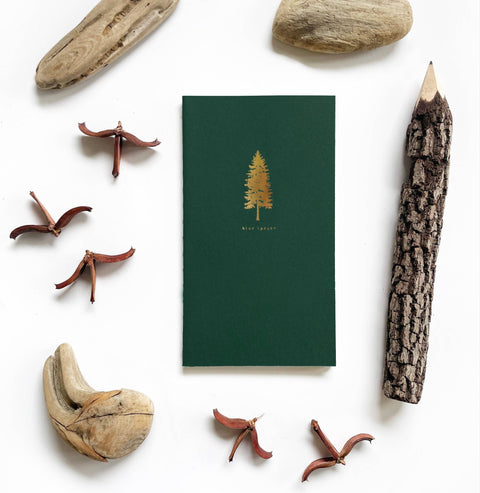 Pocket size Saddle Stitch Notebook with Pine Tree cover from Loblolly Press, featuring stitched binding and natural paper pages.