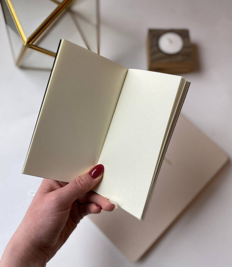 Pocket-sized Saddle Stitch Notebook featuring a pine tree design by Loblolly Press, with visible spiral binding and soft cover.